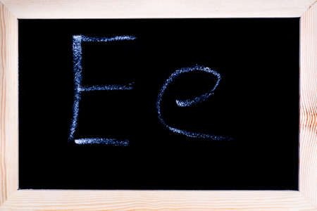 Blackboard with white chalk writing showing capital and lowercase Eの写真素材