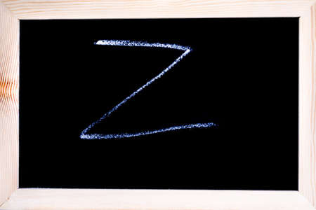 Blackboard with white chalk writing showing capital letter Zの写真素材