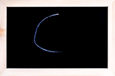 Blackboard with white chalk writing showing grade Cの写真素材