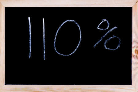 Blackboard with 110% written on itの写真素材