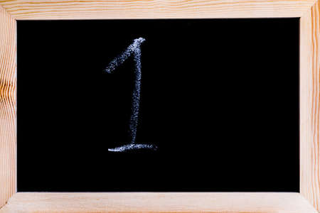 Blackboard with the number 1 written on itの写真素材
