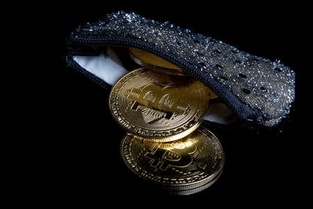 A bitcoin concept of coins spilling out of a purseの写真素材