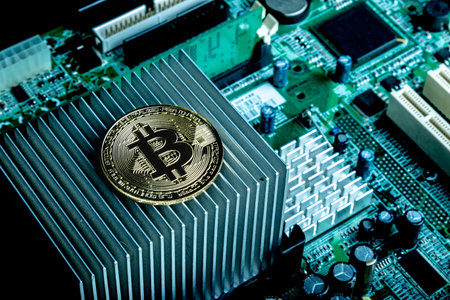 A bitcoin concept with tokens on a computer circuit board showing the currency is virtual