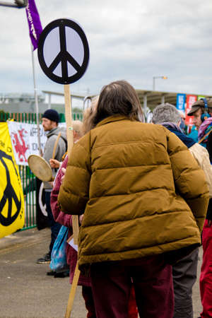 Aldermaston, United Kingdom, 1st April 2018:- CND protesters gather outside the main gate to the AWE where Britainâs nuclear warheads are made, on the 60th anniversary of the first CND march in 1958のeditorial素材