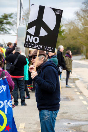 Aldermaston, United Kingdom, 1st April 2018:- CND protesters gather outside the main gate to the AWE where Britainâs nuclear warheads are made, on the 60th anniversary of the first CND march in 1958のeditorial素材