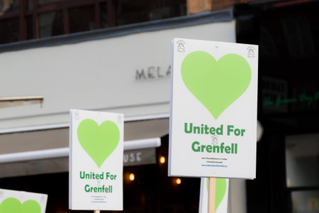 London, United Kingdom, 14th April 2018:- Marchers on a silent march from Kensington Town Hall to...