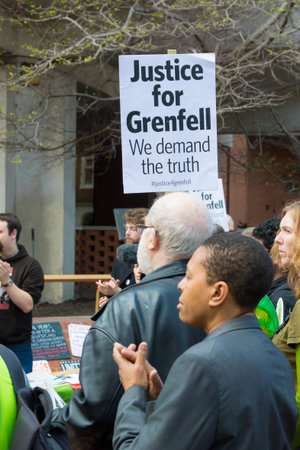 London, United Kingdom, 14th April 2018:- Marchers on a silent march from Kensington Town Hall to...