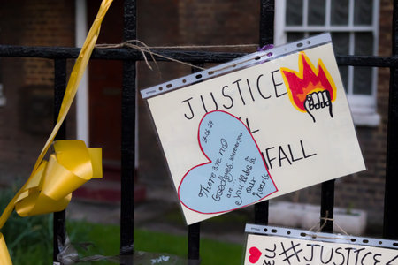 London, United Kingdom, 14th April 2018:- Banners near the ruins of Grenfell tower ten months on...