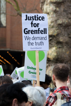 London, United Kingdom, 14th April 2018:- Marchers on a silent march from Kensington Town Hall to...