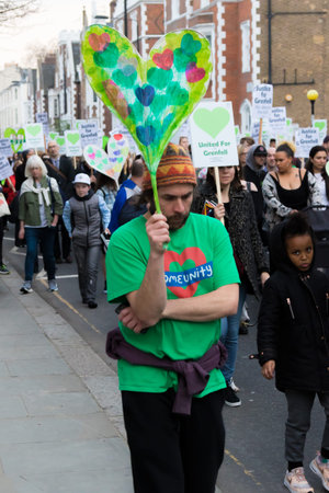 London, United Kingdom, 14th April 2018:- Marchers on a silent march from Kensington Town Hall to...