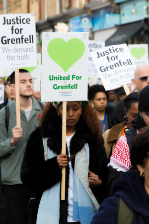 London, United Kingdom, 14th April 2018:- Marchers on a silent march from Kensington Town Hall to...