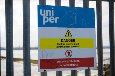 Isle of Grain, United Kingdom, 18th May 2018:- Warning signs near the cooling water outfall from the Isle of Grain power stationのeditorial素材