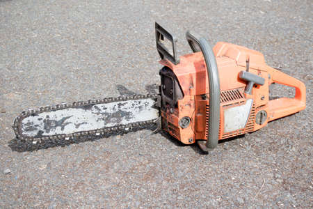 A well used chainsaw used by a tree surgeonの写真素材