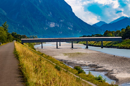 The old wooden bridge across the river Rhine on the border of Liechtenstein and Switzerland