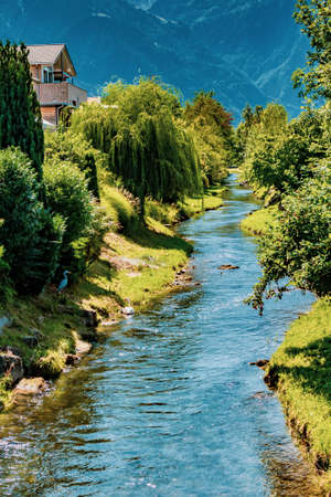 The Oberaukanal flowing through the outskirts of Vaduz, Liechtensteinの写真素材