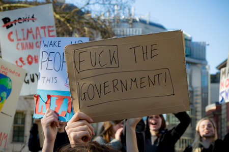 London, UK, United Kingdom 15th February 2019:- Striking school aged children in central London over climate change holding placardsのeditorial素材