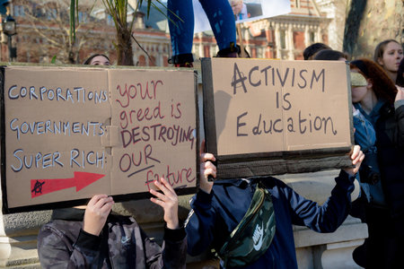London, UK, United Kingdom 15th February 2019:- Striking school aged children in central London over climate change holding placardsのeditorial素材