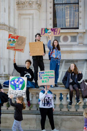 London, UK, United Kingdom 15th February 2019:- Striking school aged children in central London over climate change holding placardsのeditorial素材