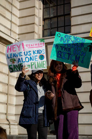 London, UK, United Kingdom 15th February 2019:- Striking school aged children in central London over climate change holding placardsのeditorial素材