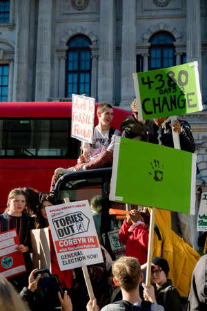 London, UK, United Kingdom 15th February 2019:- Striking school aged children in central London over climate change stage a sit down protest blocking Whitehall near Downing Streetのeditorial素材
