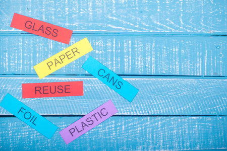Recycle concept showing on waste items listed with reuse a blue weathered background with copy space
