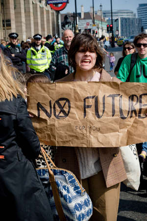 London, United Kingdom, 15th April 2019:- Extinction Rebellion protesters in Parliament Square, protesting about climate change.のeditorial素材
