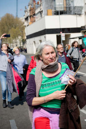 London, United Kingdom, 15th April 2019:- Extinction Rebellion protesters block and march down Whitehall past Downing Street to wards Parliament Square over climate changeのeditorial素材