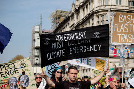 London, United Kingdom, 15th April 2019:- Extinction Rebellion protesters in Parliament Square, protesting about climate change.のeditorial素材