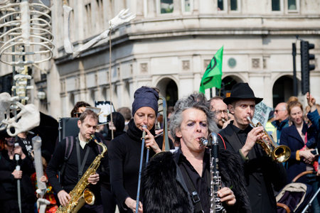 London, United Kingdom, 15th April 2019:- Extinction Rebellion protesters in Parliament Square, hold...