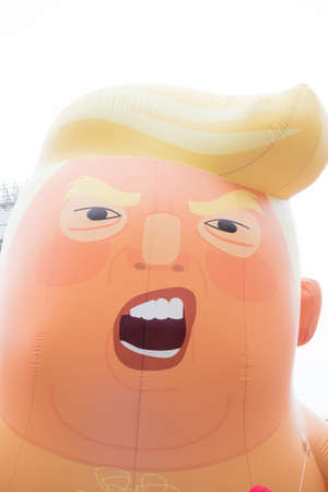 London, United Kingdom, June 4th 2019:- The face of the Trump Baby Blimp in Parliament Squareのeditorial素材
