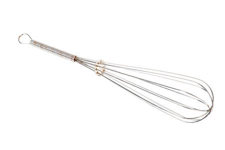 A metal egg whisk isolated on a white background