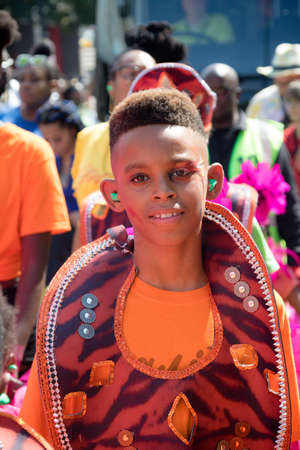 London, United Kingdom, August 25th 2019:-A young performer at the Notting Hill Carnival in West London, the Notting Hill Carnival is Europe's largest street party.のeditorial素材