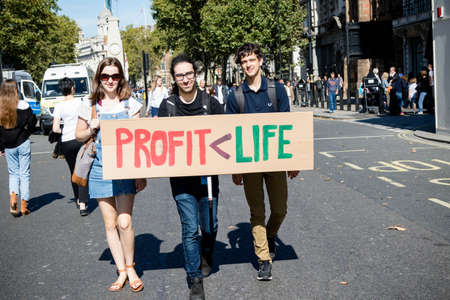 London, United Kingdom, 20th September 2019:- Climate Change Protesters gather in Westminster, central London near the British Parliament as part of a global day of protestのeditorial素材