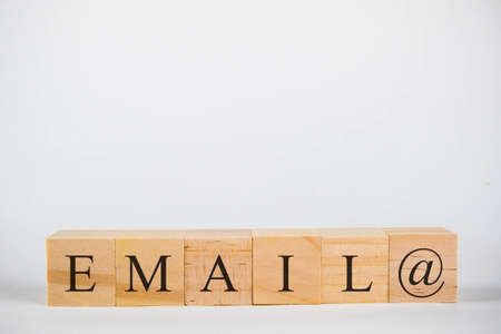 Wooden cubes with lettering spelling Email with a @ symbolの写真素材