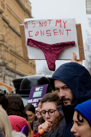 London, United Kingdom, March 8th 2020:- Signs held by people taking part in the March For Women...
