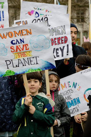 London, United Kingdom, March 8th 2020:- People take part in the March For Women hosted by Care...