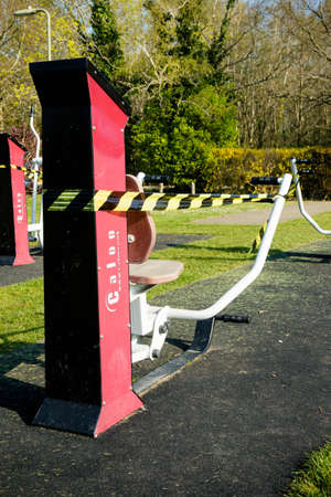 Yateley, United Kingdom, 9th April 2020:- Taped off public exercise equipment during the Covid-19 outbreakのeditorial素材