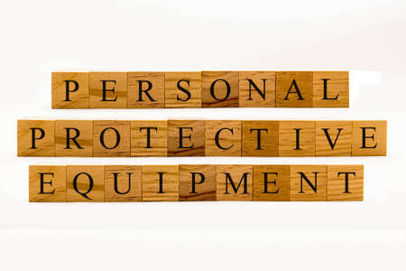 Coronavirus concept showing wooden blocks on a white background reading Personal Protective Equipmentの写真素材
