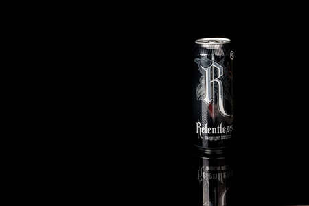 London, United Kingdom, 14th October 2020:- A can of Relentless Origin Energy Drink Isolated on a black backgroundのeditorial素材