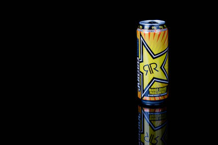 London, United Kingdom, 14th October 2020:- A can of Rockstar Mango Orange Passionfruit Energy Drink Isolated on a black backgroundのeditorial素材