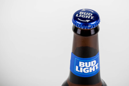 Sandhurst, United Kingdom; February 13th 2021:- A close up of bottle of Bud Light isloated on a white backgroundのeditorial素材