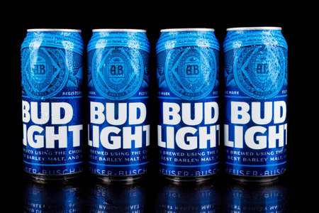 Sandhurst, United Kingdom; February 13th 2021:- Fur cans of Bud Light isolated on a black background