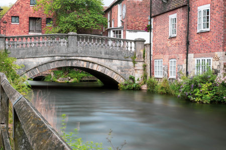 Winchester, United Kingdom, 10th August 2021:- A Long Exposure Of The Bridge Over the River Itchen...