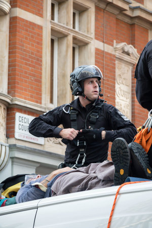 London, United Kingdom, 21st August 2021:- Specialist police officers work to remove an Extinction...