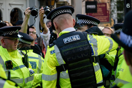 London, United Kingdom, 21st August 2021:- An Extinction Rebellion protester is arrested after being...
