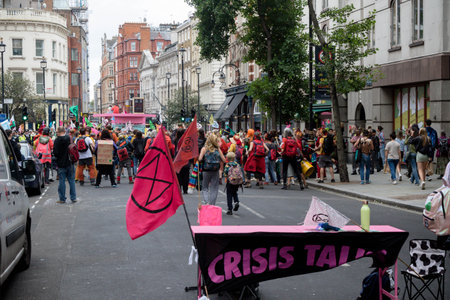 London, United Kingdom, 21st August 2021:- Extinction Rebellion protesters block a road during a protest in Central Londonのeditorial素材