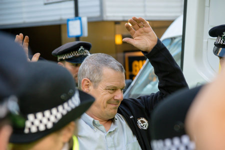 London, United Kingdom, 21st August 2021:- An Extinction Rebellion protester is arrested after being...