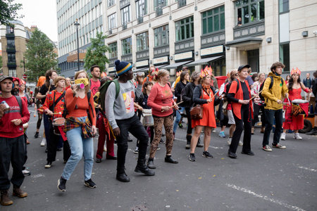 London, United Kingdom, 21st August 2021:- A Samba band joins Extinction Rebellion protesters during...
