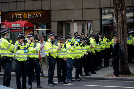 London, United Kingdom, 21st August 2021:- Police lines during an Extinction Rebellion protest in...