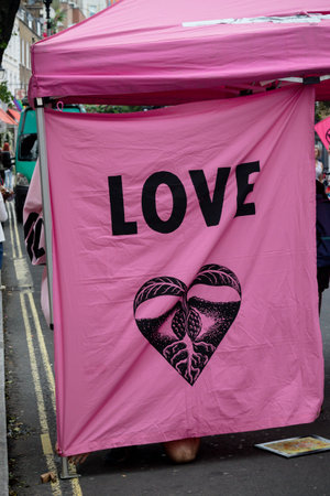London, United Kingdom, 21st August 2021:- Extinction Rebellion banners on a gazebo during a  protest in central Londonのeditorial素材